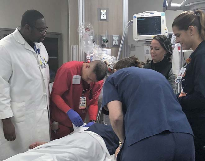 Medical team providing care in hospital room