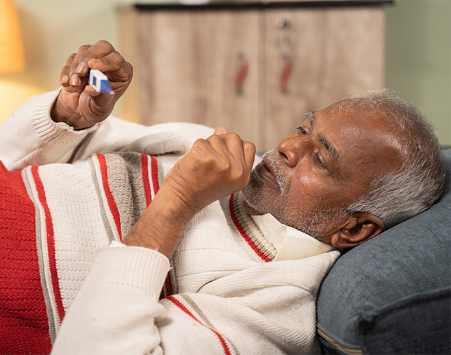 Person using inhaler while resting