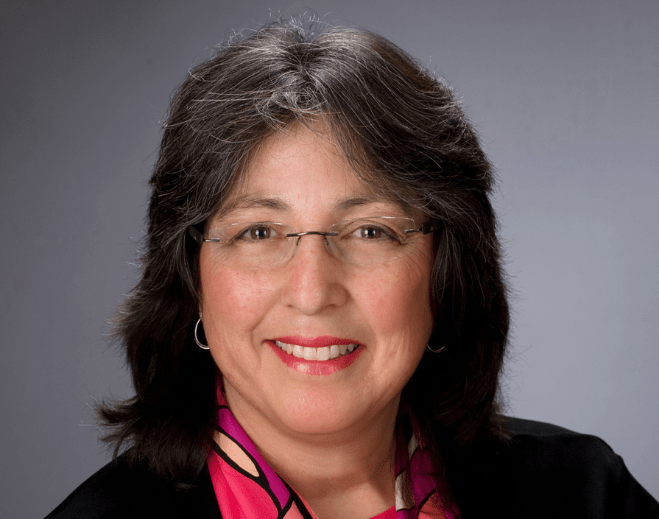 Professional portrait with glasses and scarf