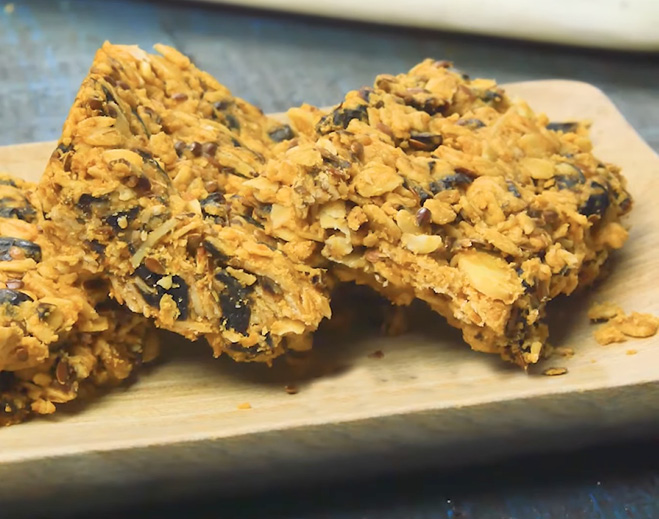Homemade granola bars on board