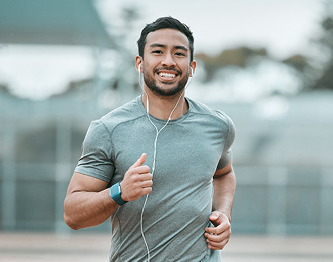 Runner jogging outdoors with earphones
