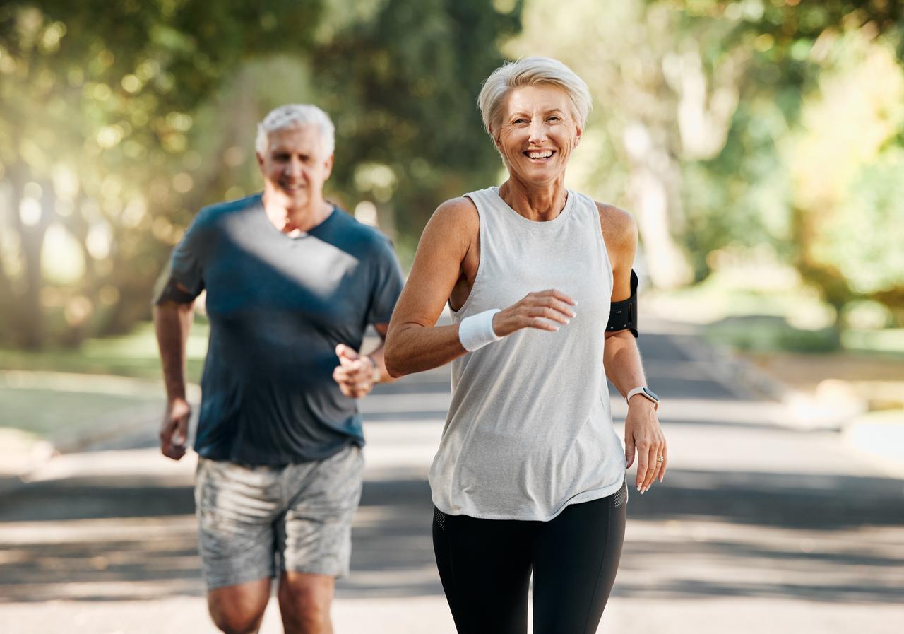 An old man and woman running